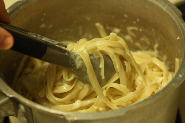 Toss the hot pasta on top of the cheese